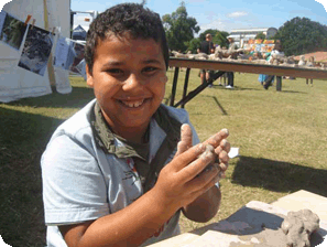 boy with her clay model