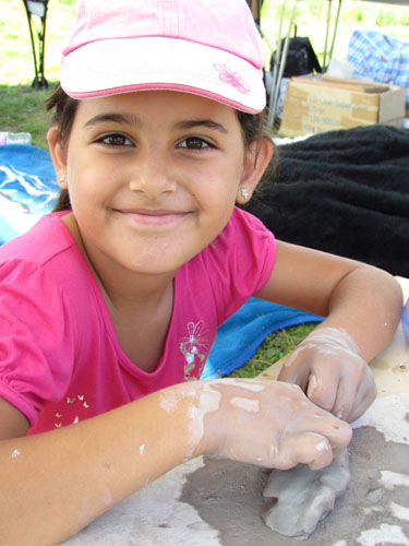 girl with her clay model