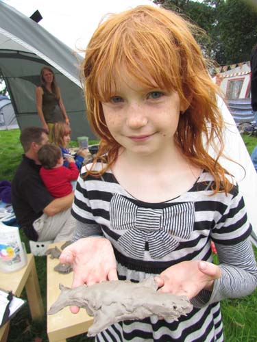 girl with his clay model