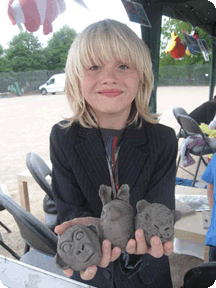 girl with her clay model