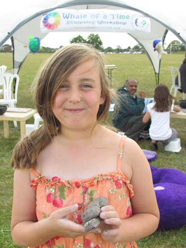 girl with her clay model